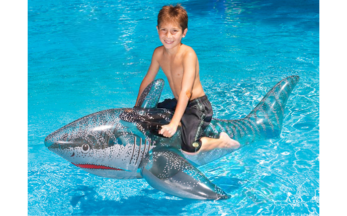 Swimline Pool Shark Ride-On Float 72" 9045 in a pool with kids playing