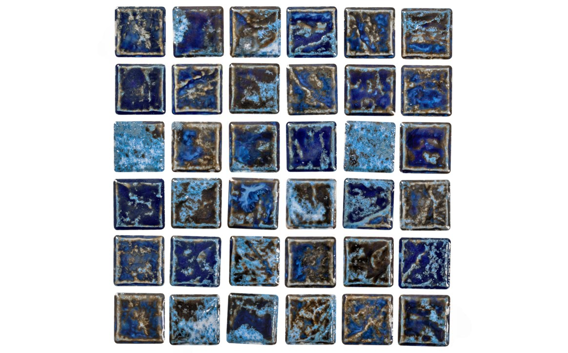 Close-up of glossy cobalt and gold tile