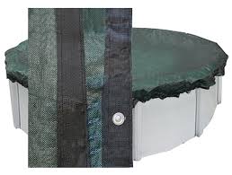 Winter pool cover with secure cable and winch system for strong protection.
