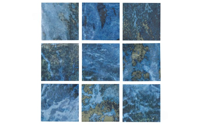 Elegant blue tiles installed in backyard pool