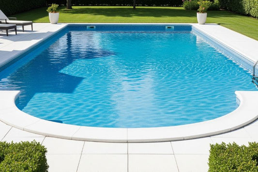 Clear blue pool shimmers in a serene suburban backyard setting.