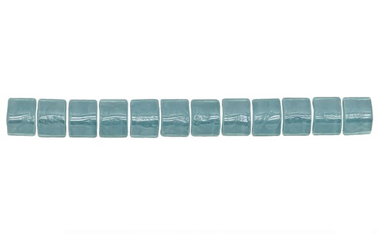 Close-up of Sea Breeze Teal V-Cap Strip glass mosaic tile showing iridescent finish