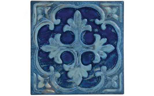 Close-up of Renaissance-style cyan floral pool tile