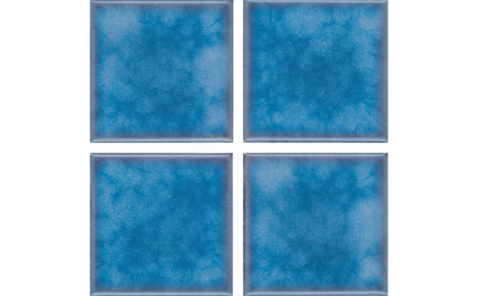 Styled installation of Akron 3x3 field tile in a serene outdoor pool