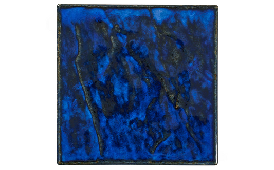 Close-up of high-gloss royal blue pool tile